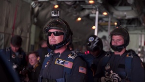 Wings of Blue Parachute Team performs jump during FIDAE 2018