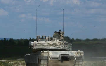 M1 Abrams Tank Fires Main Gun