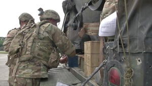 2CR Soldiers pick up ammunition and cross wet gap with help from Germans and British