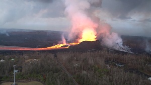 Aerial Survey of River of Lava as it Flows Down Valley in Hawaii
