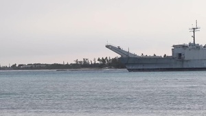 USNS Sioux tugs the decommissioned tank landing ship Ex-Rancine out to sea