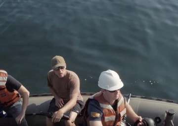 Collecting and reviewing footage captured using a remotely operated vehicle from the site of USS San Diego (ACR 6).