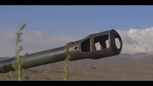 Australian soldiers and Indonesia fire artillery with U.S. Marines together during RIMPAC