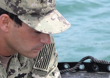 US Navy Teams Survey The USS Arizona Memorial During RIMPAC 2018