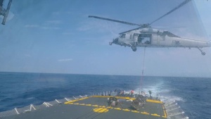 HMCS Vancouver helicopter resupply at sea during RIMPAC 2018