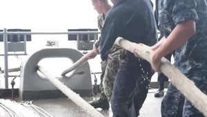 GHWB Sailors Pull Mooring Lines