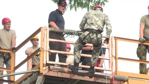Multinational firefighters repelling and climbing at Alpena Combat Readiness Training Center during Northern Strike 18