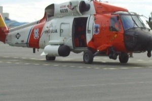 Coast Guard Air Station Kodiak aircrews conduct routine checks to prepare for take off