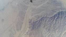 Reconnaissance Marines glide through the air during Exercise Desert Canopy