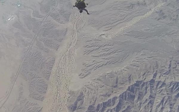 Reconnaissance Marines glide through the air during Exercise Desert Canopy