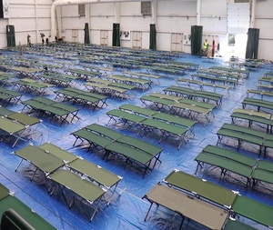 VNG personnel assist setting up state-managed shelters