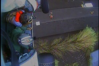 Air Station Elizabeth City saves man and his dog 'Lucky' from roof hoist camera
