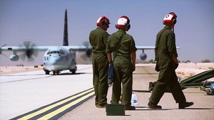 Marines simultainiously refuel and load ordnance