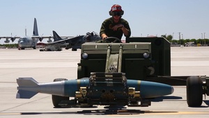Marines Simultainiously Refuel and Load Ordnance