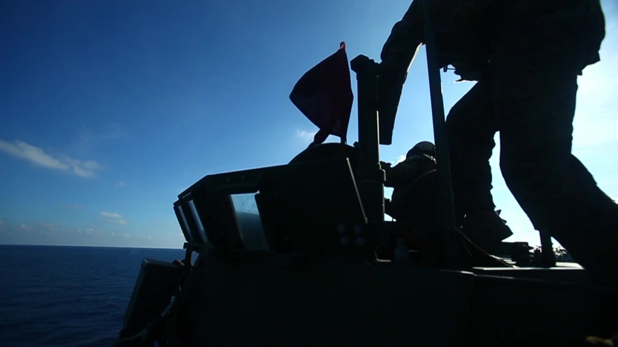Marines with Weapons Company, Battalion Landing Team, 2nd Battalion, 5th Marines, fire a Light Armored Vehicle&#39;s M242 Bushmaster 25 mm chain gun during gunnery training from the portside aircraft elevator aboard the amphibious assault ship USS Wasp (LHD 1), underway in the South China Sea, Sept. 29, 2018. During the training, the Marines staged LAVs on the Wasp&#39;s flight deck to refine their gunnery capabilities to act as ship security. The 31st Marine Expeditionary Unit, the Marine Corps’ only continuously forward-deployed MEU, provides a flexible force ready to perform a wide-range of military operations in the Indo-Pacific region.