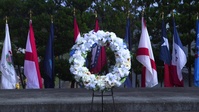 U.S. Marines and Japanese locals honor the lives taken at CATC fire