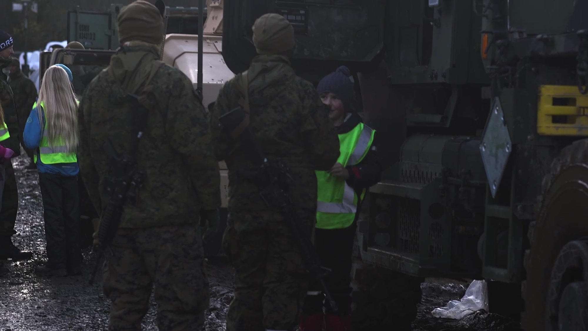 U.S. Marines with 2d Marine Division, II Marine Expeditionary Force, along with Norwegian military leadership conduct a tour of Tactical Assembly Area (TAA) Voll to children from a local school in Voll, Norway, Oct 24, 2018, in preparation for exercise Trident Juncture 18 (TJ18). Children were welcomed to TAA Voll and were allowed to sit in running tactical vehicles, went through 305 tents, and enjoyed Meal Ready to Eat (MRE) with the Marines. 2d Marine Division is a proud to serve alongside the Norwegian military during TJ18. (U.S. Marine Corps Video by Staff Sgt. Omar V. Elorza)