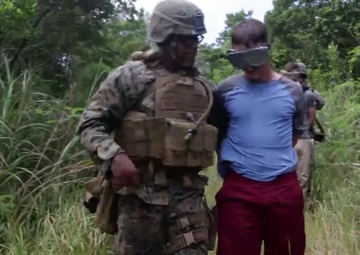 Patrol, detain, and escort: Law Enforcement Marines simulate hostage handling