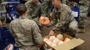 Unit ministry teams distribute food before Thanksgiving holiday
