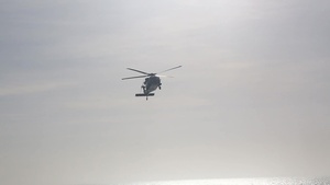 Helicopters Transport Patients to the USNS Comfort from Land-Based Medical Sites