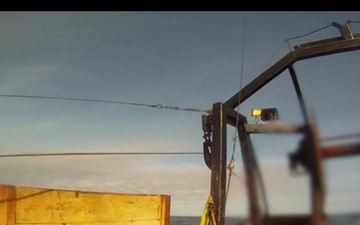 F/V Bulldog releases cables and net during Coast Guard boarding