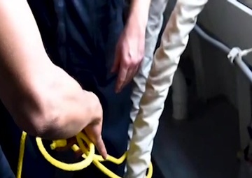 Sailors Handle Line Aboard USS Michael Monsoor