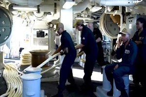 Sailors Handle Mooring Line
