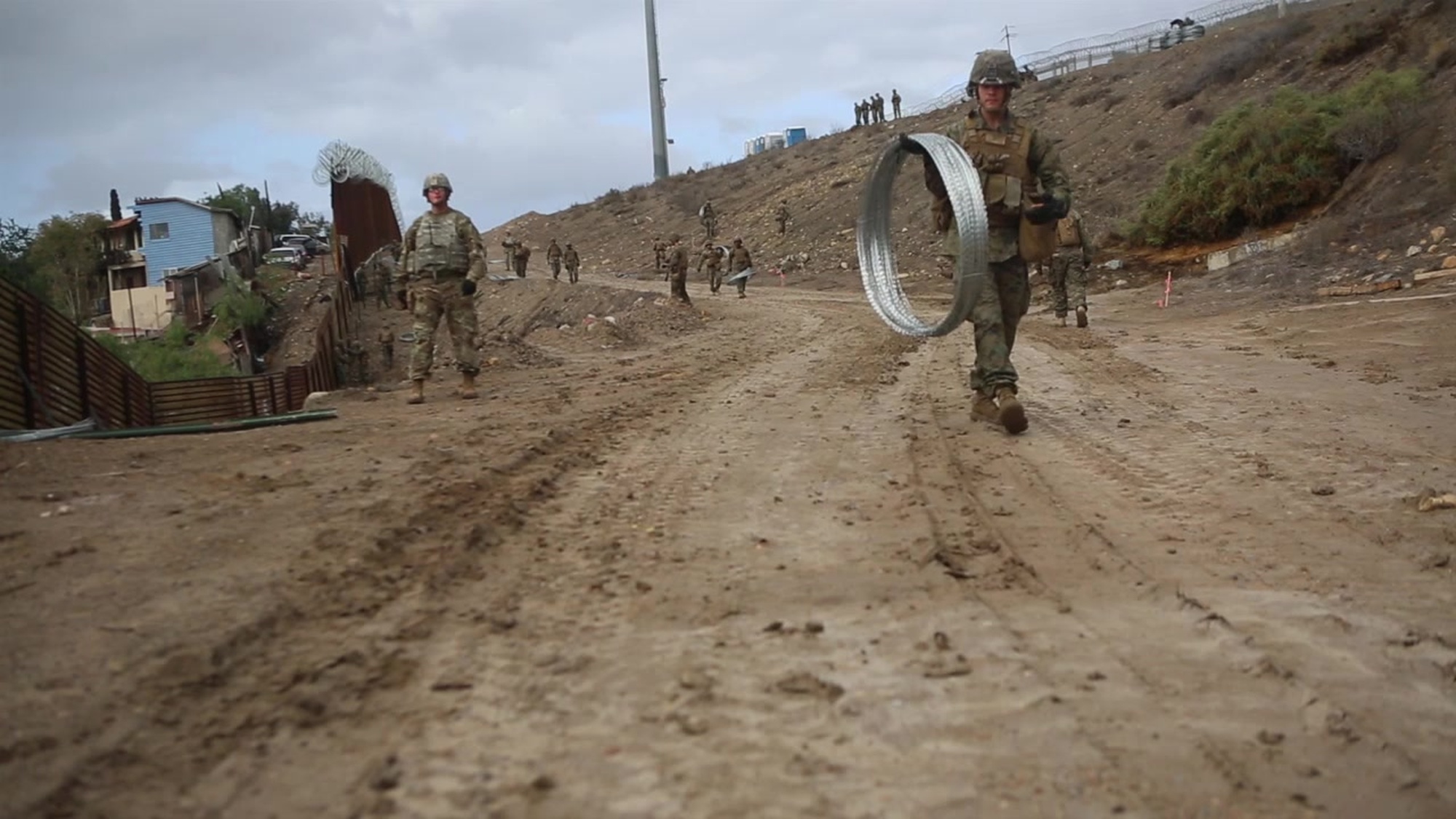 U.S. Marines with 7th Engineer Support Battalion, Special Purpose Marine Air-Ground Task Force 7, emplace fortifications near the San Ysidro Port of Entry at the California-Mexico border on Nov. 30, 2018. U.S. Northern Command is providing military support to the Department of Homeland Security and U.S. Customs and Border Protection to secure the Southern border of the United States. (U.S. Marine Corps video by Lance Cpl. Jared Curtis)