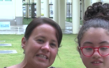 USAF Sgt. Maria Ferrer and daughter give a holiday shout out from Kadena Middle School.