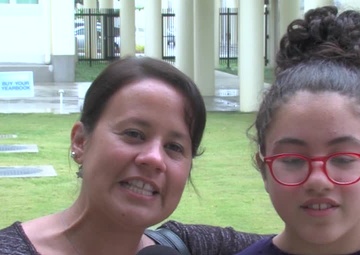 USAF Sgt. Maria Ferrer and daughter give a holiday shout out from Kadena Middle School.