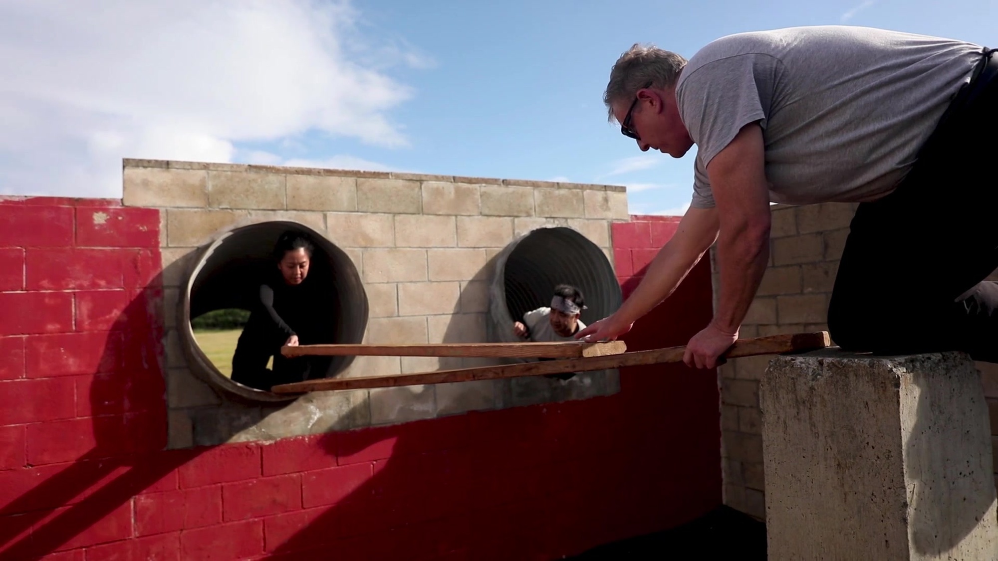 Members of the executive leadership development program participate in the obstacle course and leadership reaction course at Landing Zone Boondocker during their visit to Marine Corps Base Hawaii, Dec. 11, 2018. The program provides leadership development opportunities and addresses key competencies for high potential employees at the GS-13 and 14 levels or equivalent whose career plans include moving into upper management positions. (U.S. Marine photo by Sgt. Zachary Orr)