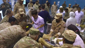 U.S. Soldiers and Kuwaiti Land Forces exchange practices during CBRN exercise