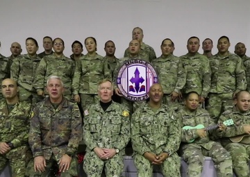 Admiral James Foggo sings Mele Kalikimaka with Soldiers in Kosovo