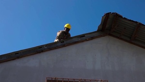 Joint Task Group Engineer Build Temporary Roofs for Saipan resident