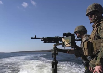 Marines shoot M240B Machine Gun off a MK-III Bridge Erection Boat