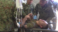 U.S. Marines and Sailors and Japan Ground Self-Defense Force Soldiers practice realistic combat medical training during Iron Fist