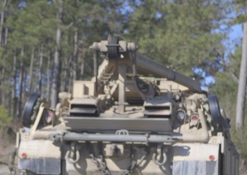 Marines use bridging techniques to move tanks across water