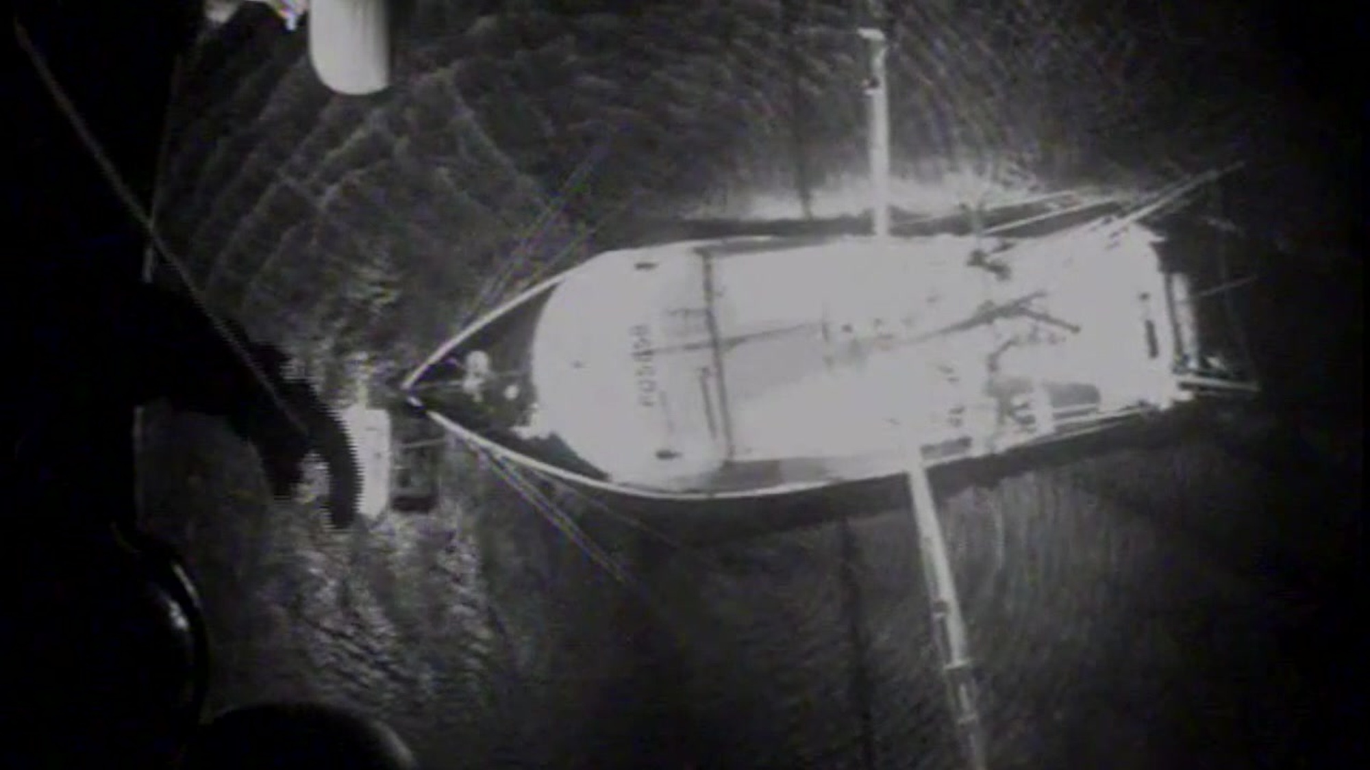 A rescue swimmer from Air Station Elizabeth City is lowered down to the crew of the fishing vessel Amanda Ashley Wednesday, Feb. 6, 2019, approximately 70 miles east of Cape Henry, Virginia. A 53-year-old man was medevaced off the vessel in an MH-65 Jayhawk helicopter from Air Station Elizabeth City after he reported shortness of breath. (U.S. Coast Guard video courtesy of Air Station Elizabeth City)