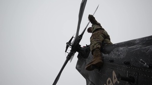 40-hour maintenance on 1CAB 1ID UH-60 Black Hawk in cold weather