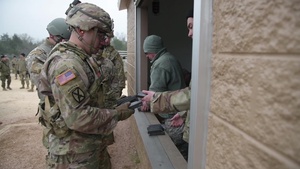 Texas Best Warrior Competition service members participate in M9 marksmanship evaluation