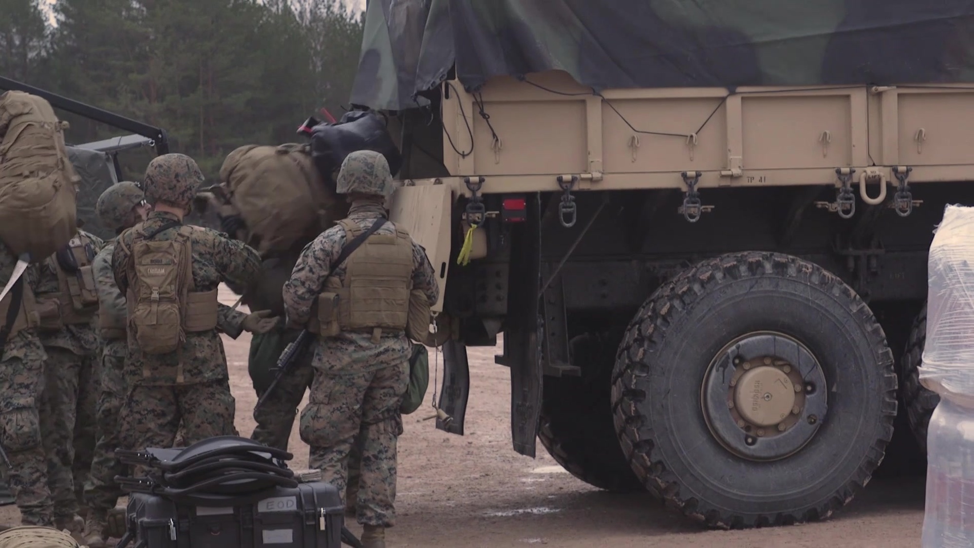 U.S. Marines and Sailors with 14th Marine Regiment, 4th Marine Division, discuss the cold-weather conditions during Dynamic Front 19 in Adazi Training Area, Latvia, March 3, 2019. Exercise Dynamic Front 19 includes approximately 3,200 service members from 27 nations who are observing or participating from Grafenwoehr Training Area, Germany; Riga, Latvia; and Torun, Poland; during March 2-9, 2019. Dynamic Front is an annual U.S. Army Europe exercise focused on the readiness and interoperability of U.S. Army, joint service, and allied and partner nations’ artillery and fire support working together in a multinational environment.