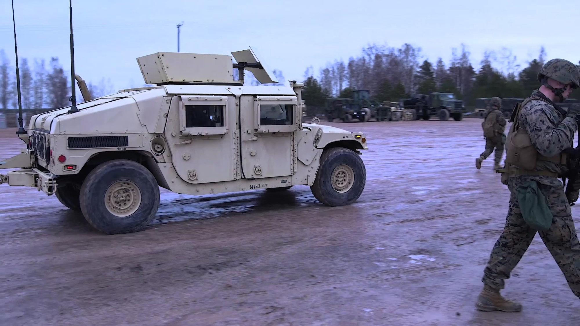 U.S. Marines and Sailors with 14th Marine Regiment, 4th Marine Division, discuss the cold-weather conditions during Dynamic Front 19 in Adazi Training Area, Latvia, March 3, 2019. Exercise Dynamic Front 19 includes approximately 3,200 service members from 27 nations who are observing or participating from Grafenwoehr Training Area, Germany; Riga, Latvia; and Torun, Poland; during March 2-9, 2019. Dynamic Front is an annual U.S. Army Europe exercise focused on the readiness and interoperability of U.S. Army, joint service, and allied and partner nations’ artillery and fire support working together in a multinational environment.