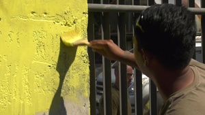 Soldiers paint walls at Santa Julia Elementary School