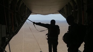 Marines conduct a static line jump from a KC-130J