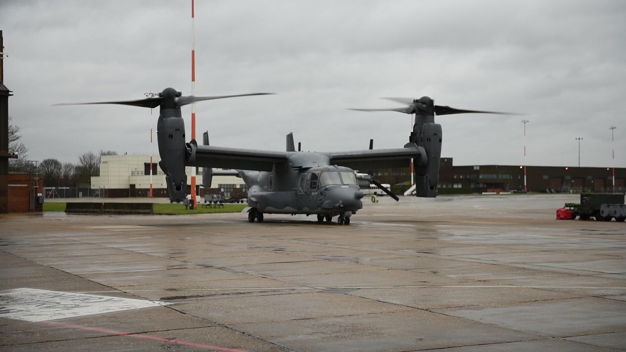 A U.S. Air Force CV-22 Osprey from the 352d Special Operations Wing, RAF Mildenhall, prepares to take-off on the flightline. The aircraft performs a routine take-off and landing.