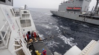 U.S. Coast Guard Cutter Bertholf receives fuel from the USNS Walter S. Diehl during an underway replenishment in the East China Sea