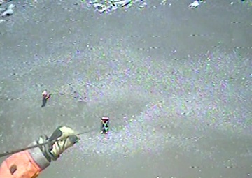 Coast Guard aircrew hoists two from British Columbia beach