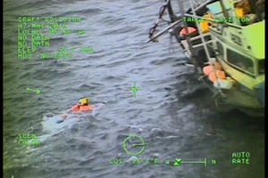 Coast Guard Air Station Sitka Rescue Swimmer Assists in Dewatering Sinking Vessel Near Kake, Alaska