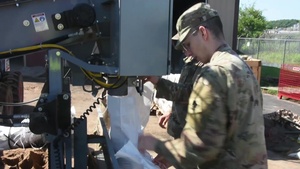Corps of Engineers employee fills sandbags, need to serve while supporting flood fight response