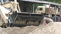 Missouri Guardsmen work with local civilians to sure up a levee.